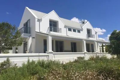 a large white house on top of a hill at Stellenbosch family villa in Stellenbosch