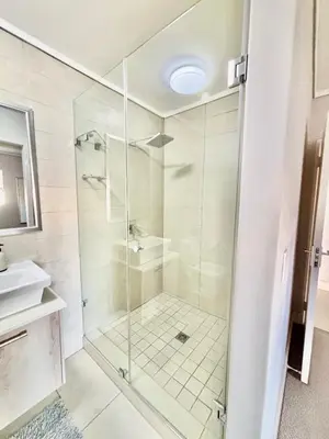 a bathroom with a shower and a sink at Luxe Waters Edge apt next to Canal Walk in Cape Town