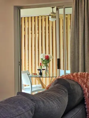 a living room with a couch and a table and a window at Max 7 in Helderberg