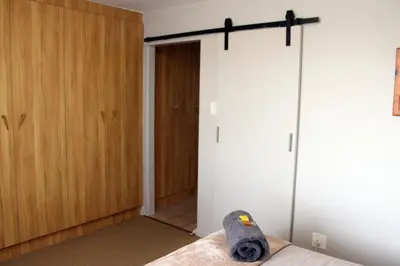 a skateboard laying on a bed in a bedroom at Grace Haven Self Catering in Hermanus