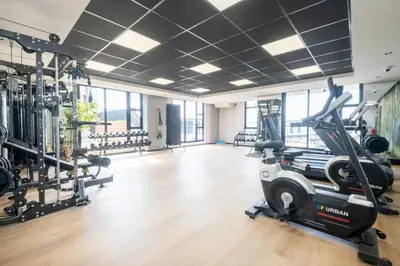 a gym with treadmills and a treadmill at Riverlands - Lux 1 bedroom Apartment with Parking in Cape Town