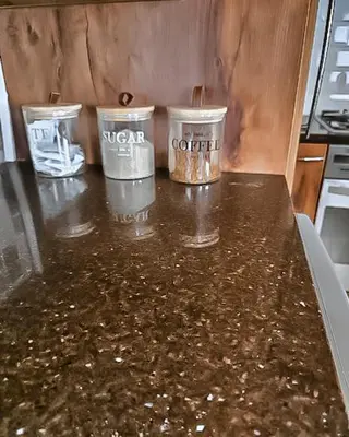 three trash cans sitting on a counter in a kitchen at Elianta House in Cape Town