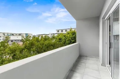 a balcony with a view of a city at The Orion 18 in Table View