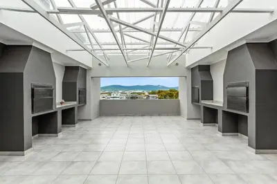 an empty room with a glass ceiling with a view at The Orion 18 in Table View