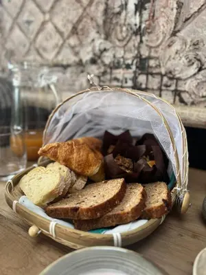 a basket of bread and toast on a table at Leopard Lodge in Hermanus