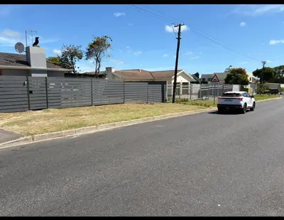 a white car parked on the side of a street at Joy House in Cape Town