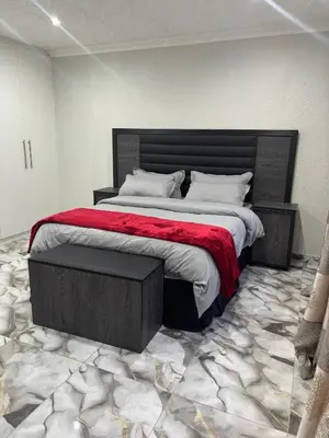 a bedroom with a large bed with a red blanket at Luxurious Family Home 2
