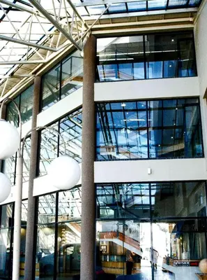 a large building with glass windows in a building at The Strand Pavilion Gordon's Bay in Strand