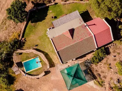 an overhead view of a house and a swimming pool at Rivergrace Farm in Robertson
