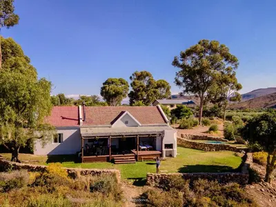 an aerial view of a house with a yard at Rivergrace Farm in Robertson
