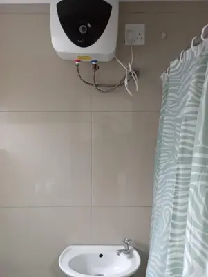 a bathroom with a sink and a speaker on the wall at 8 Botha Goodwood the trout lodge in Elsiesrivier