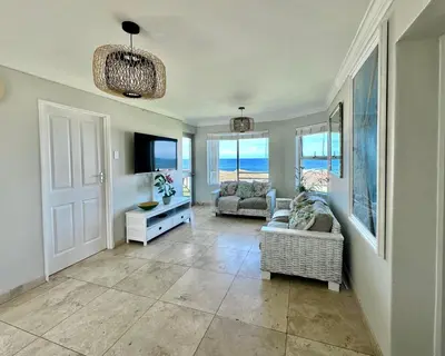 a living room with two chairs and a couch at Ocean View in Hermanus