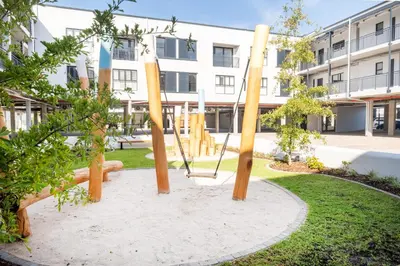 a swing in a park in front of a building at Paarl Superior Studio 230 With Onsite Parking in Paarl