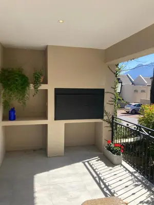a flat screen tv on the wall of a house at Villa 121 Franschhoek Lermitage in Franschhoek