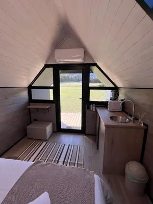 a small kitchen with a sink and a window at Leliefontein Eco Cottage and Glamping in Paarl