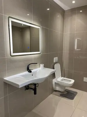 a bathroom with a sink and a toilet at Jorash Guesthouse in Cape Town