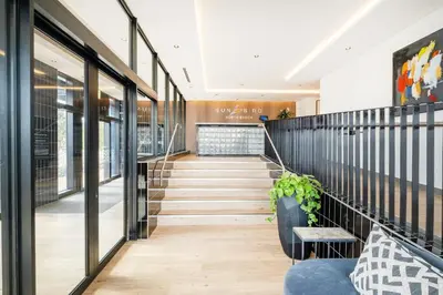 a staircase in a building with a lobby at 317 Riverlands - Lux 1 bedroom Apartment in Cape Town