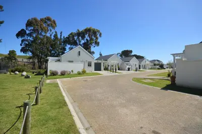 a driveway of houses in a residential neighborhood at Tweespruit Estate - Stellenbosch- 3 Bedroom House in Stellenbosch