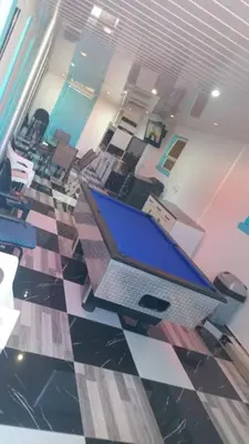 an office with a laptop computer on a checkered floor at Neo & Ruks excellent Rooms in Goodwood