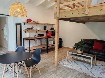 a living room with a table and a couch at Your Quiet Retreat Near Cape Town & Wine Country in Hoheizen