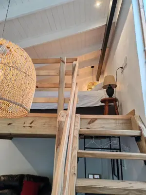 a loft bed in a room with a bed on top at Your Quiet Retreat Near Cape Town & Wine Country in Hoheizen
