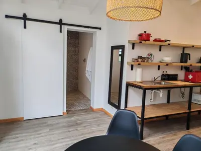 a room with a table and a mirror and a door at Your Quiet Retreat Near Cape Town & Wine Country in Hoheizen