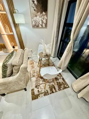 a living room with a couch and a chair at DRJ Luxe Table view in Table View