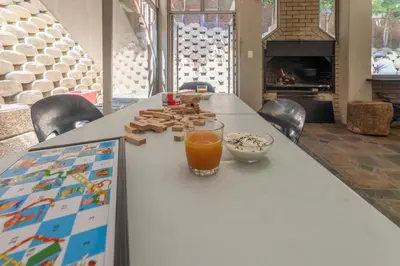 a table with a glass of orange juice on it at TwinPalace in Plattekloof