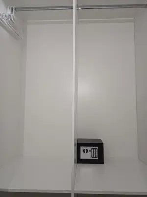 a clock on a wall next to a window at Cozy Cove in Cape Town