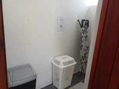 a corner of a room with a trash can at Cozy Cove in Cape Town