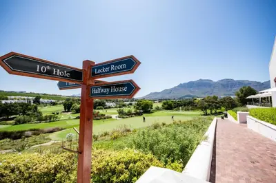 a street sign in front of a golf course at Winelands Golf Lodges 34 at De Zalze in Cape Town