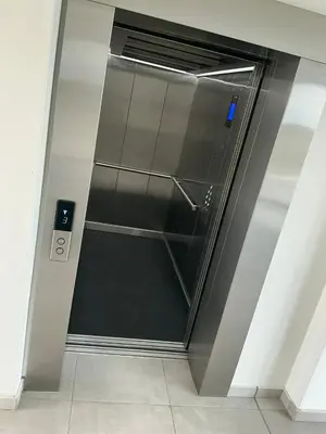 a elevator with a glass door in a building at DRJ Luxe in Cape Town