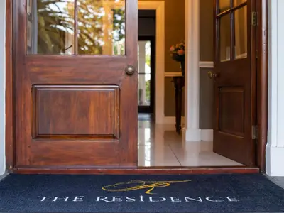 a door with a sign that reads the residence at The Residence Boutique Hotel in Grabouw