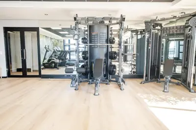 a gym with two treadmills and weights at 507 Riverlands - Lux Studio Apartment in Cape Town