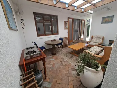 a living room with a couch and a table at 28 on Old Farm in Cape Town