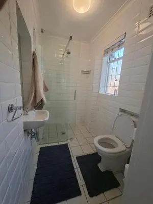 a bathroom with a toilet and a sink at 28 on Old Farm in Cape Town
