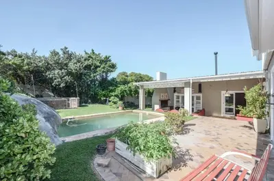 a house with a swimming pool in the yard at Large 4 Bedroom Villa with Pool in Cape Town