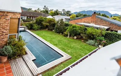 an aerial view of a backyard with a swimming pool at Protea Garden Cottage in Stellenbosch