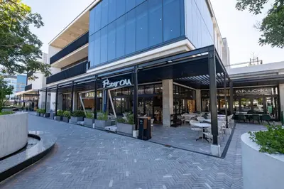 a store front of a building with tables at 413 Riverlands - 1 Bedroom Apartment with Parking in Cape Town