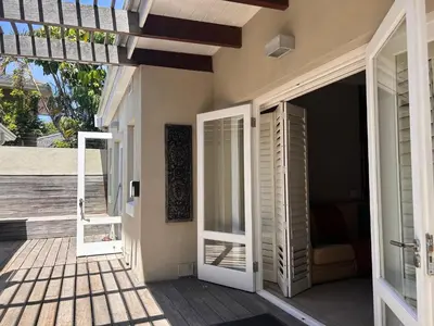 an open door of a house with a porch at Bishopsfield Guesthouse Rondebosch in Cape Town