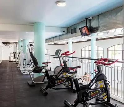 a gym with several cardio bikes and treadmills at Nice Views in Cape Town