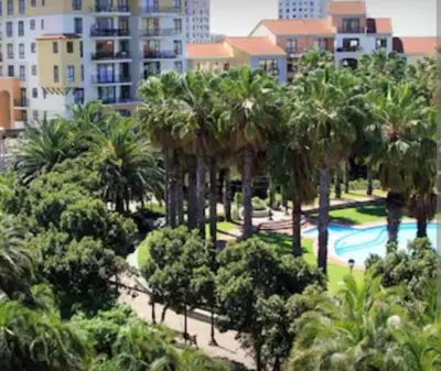 a view of a park with palm trees and a pool at Nice Views in Cape Town
