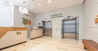 an empty lobby with two elevators in a building at Andringa Walk, Modern 2 Bedroom Apartment in Stellenbosch