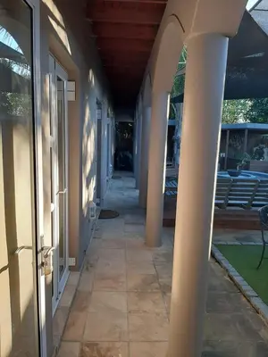 an empty hallway of a house with columns at Simply The Choice Manor in Cape Town