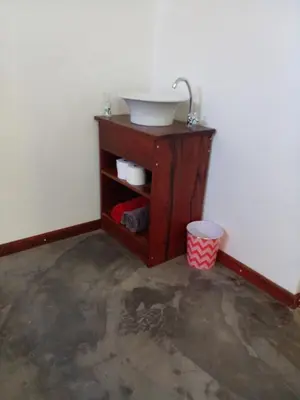 a bathroom with a sink in a room at Groendraai PetFriendly SelfCatering Accommodation, Die Karoohuis, Die Wijnhuis and Die Vinknes