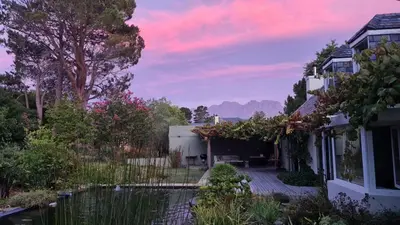 a house with a view of a yard at Tranquil Stylish Home with Nature Pool near Reserve in Somerset West