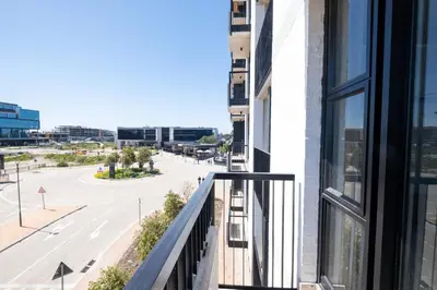 an apartment balcony with a view of a street at 207 Riverlands - 1 Bedroom Apartment with Parking in Cape Town