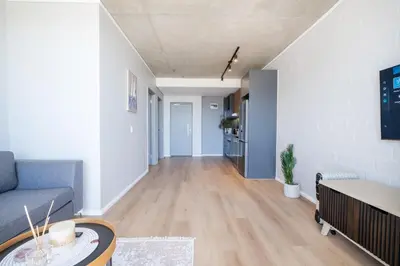 a living room with a couch and a table at 207 Riverlands - 1 Bedroom Apartment with Parking in Cape Town