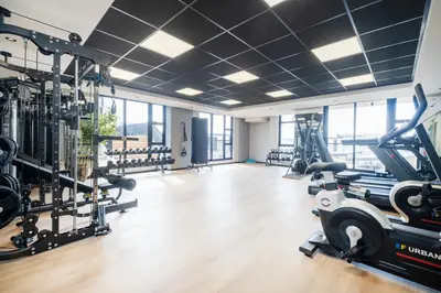 a gym with treadmills ellipticals and tread machines at 207 Riverlands - 1 Bedroom Apartment with Parking in Cape Town