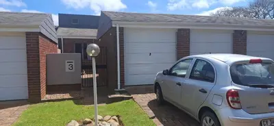 a car parked in front of a house at Pug's Room in Welgemoed